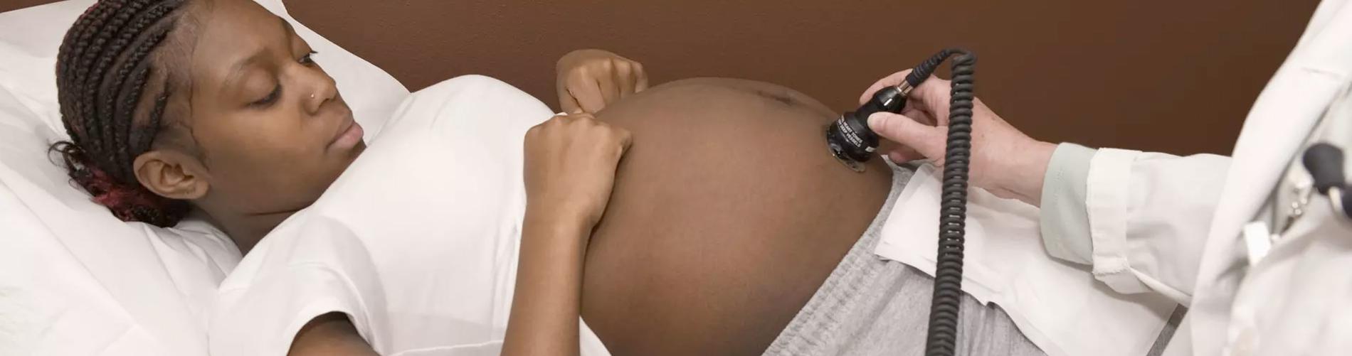 Pregnant mother getting her unborn baby examined